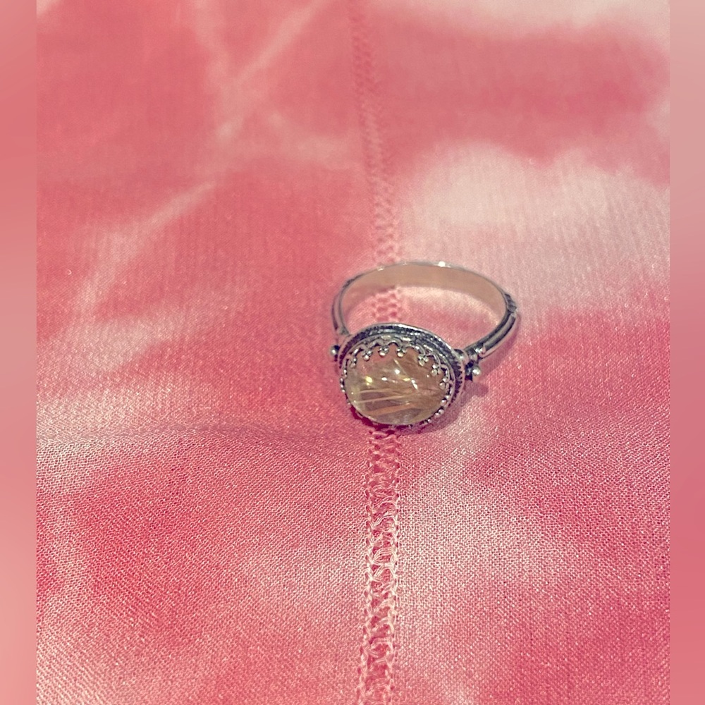 Silver ring with pale yellow stone